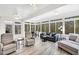 Bright sunroom featuring lots of windows, a ceiling fan and comfortable seating at 1478 Suncrest Dr., Myrtle Beach, SC 29577