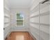 Walk-in closet with ample shelving and a window providing natural light at 152 Shenandoah Dr., Murrells Inlet, SC 29576