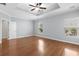 Spacious bedroom with hardwood floors, tray ceiling, ceiling fan, and natural light at 152 Shenandoah Dr., Murrells Inlet, SC 29576