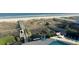 View of beach access from pool and garden areas, with ocean in the background at 1581 S Waccamaw Dr. # 303, Murrells Inlet, SC 29576
