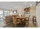 Cozy dining area adjacent to the living room, perfect for intimate meals and gatherings at 1581 S Waccamaw Dr. # 303, Murrells Inlet, SC 29576
