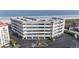 Beachfront condo building with convenient covered parking, showcasing a prime coastal location at 1581 S Waccamaw Dr. # 303, Murrells Inlet, SC 29576