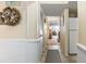 Inviting hallway leading to the living area with bright and beachy decor at 1581 S Waccamaw Dr. # 303, Murrells Inlet, SC 29576