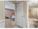 View of a bedroom and bathroom showcasing the interior layout and design at 1581 S Waccamaw Dr. # 303, Murrells Inlet, SC 29576