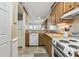 Well-maintained kitchen with classic appliances, and an open layout to the living area at 1581 S Waccamaw Dr. # 303, Murrells Inlet, SC 29576