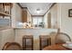 Charming kitchen offers a breakfast bar with seating, ideal for casual dining and morning coffee at 1581 S Waccamaw Dr. # 303, Murrells Inlet, SC 29576