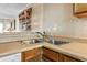 Stainless steel double basin kitchen sink with wooden cabinets and countertop at 1581 S Waccamaw Dr. # 303, Murrells Inlet, SC 29576