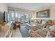 Cozy living room with a balcony view, comfortable seating, and inviting coastal decor at 1581 S Waccamaw Dr. # 303, Murrells Inlet, SC 29576