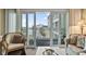 Bright living room featuring balcony access, comfortable seating, and airy coastal charm at 1581 S Waccamaw Dr. # 303, Murrells Inlet, SC 29576