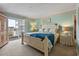 Bright main bedroom with balcony access, offering a relaxing retreat at 1581 S Waccamaw Dr. # 303, Murrells Inlet, SC 29576