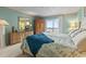 Serene main bedroom featuring ocean views, a cozy bed, and natural light at 1581 S Waccamaw Dr. # 303, Murrells Inlet, SC 29576