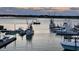 Scenic view of boats docked at a marina with clear water and a vibrant sky at 1581 S Waccamaw Dr. # 303, Murrells Inlet, SC 29576