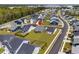 Aerial view of residential street shows landscaped lawns and sidewalks throughout community at 2105 Ballast Ct., Myrtle Beach, SC 29579