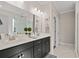 Bright bathroom featuring double vanity, sleek cabinets, and a large mirror reflecting a modern shower at 2105 Ballast Ct., Myrtle Beach, SC 29579