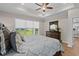 Serene bedroom with large window, comfortable bed, and classic wooden dresser at 2105 Ballast Ct., Myrtle Beach, SC 29579