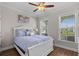 Serene bedroom with natural light, a ceiling fan, and a view of the outdoors at 2105 Ballast Ct., Myrtle Beach, SC 29579