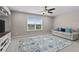 Bright bonus room with neutral walls, plush carpet, and a sofa under a window, ideal for relaxation at 2105 Ballast Ct., Myrtle Beach, SC 29579