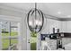 Dining room showcasing a modern chandelier and views of the backyard at 2105 Ballast Ct., Myrtle Beach, SC 29579