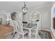 Elegant dining room with stylish chandelier, rustic table, and decorative hutch at 2105 Ballast Ct., Myrtle Beach, SC 29579