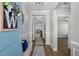 Welcoming foyer with paneled walls, hardwood floors, and a decorative wreath at 2105 Ballast Ct., Myrtle Beach, SC 29579