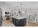 Open-concept kitchen with a large island, pendant lighting, and stainless steel appliances at 2105 Ballast Ct., Myrtle Beach, SC 29579