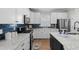 Modern kitchen featuring white cabinets, marble countertops, and stainless steel appliances at 2105 Ballast Ct., Myrtle Beach, SC 29579