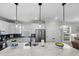 Bright kitchen island with marble countertop, pendant lighting, and ample storage space at 2105 Ballast Ct., Myrtle Beach, SC 29579