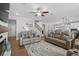 Spacious living room featuring hardwood floors, comfortable seating, and ample natural light at 2105 Ballast Ct., Myrtle Beach, SC 29579
