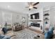 Bright living room with ceiling fan, fireplace, built-ins, and comfortable seating arrangement at 2105 Ballast Ct., Myrtle Beach, SC 29579