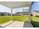View from the screened in porch onto the home's backyard with ample lawn space at 2105 Ballast Ct., Myrtle Beach, SC 29579