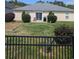 Fenced backyard with mature plantings, grassy area, and patio at 320 Mckaylas Ct., Myrtle Beach, SC 29579