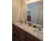 Bathroom featuring double sinks with vanities, a large mirror, and neutral tones providing a functional space at 320 Mckaylas Ct., Myrtle Beach, SC 29579