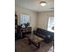 Comfortable living room featuring a black sofa, unique coffee table, and shelves for storage and décor at 320 Mckaylas Ct., Myrtle Beach, SC 29579