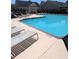 Inviting community pool with lounge chairs for relaxing by the water on a sunny day at 320 Mckaylas Ct., Myrtle Beach, SC 29579