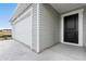 Attached two-car garage and an inviting front entrance to a newly constructed home at 33 Cape Point Dr., Conway, SC 29527