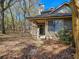 A view of the property's backyard, with a patio area, landscaping, and a building at 400 Melrose Pl. # 14-A, Myrtle Beach, SC 29572