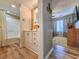 Charming bathroom featuring wood accents, a vanity, and a tub with shower at 400 Melrose Pl. # 14-A, Myrtle Beach, SC 29572