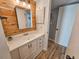 Bathroom featuring a vanity, wood accents, and a bright, airy atmosphere at 400 Melrose Pl. # 14-A, Myrtle Beach, SC 29572