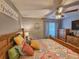 Inviting bedroom with colorful bedspread, wood furniture, and soft lighting at 400 Melrose Pl. # 14-A, Myrtle Beach, SC 29572