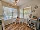 Bright breakfast nook featuring a cozy table, chairs, and views of the outside at 400 Melrose Pl. # 14-A, Myrtle Beach, SC 29572