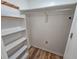Walk-in closet with shelving, a clothing rack, and wood flooring at 400 Melrose Pl. # 14-A, Myrtle Beach, SC 29572