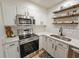Well-equipped kitchen with stainless steel appliances and elegant countertops at 400 Melrose Pl. # 14-A, Myrtle Beach, SC 29572