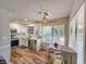 Bright kitchen with white cabinetry, stainless steel appliances, and an eat-in area at 400 Melrose Pl. # 14-A, Myrtle Beach, SC 29572