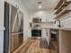 Modern kitchen featuring stainless steel appliances, white cabinets, and stylish backsplash at 400 Melrose Pl. # 14-A, Myrtle Beach, SC 29572