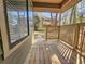 A porch view showcasing wood flooring, railing, and exterior view at 400 Melrose Pl. # 14-A, Myrtle Beach, SC 29572