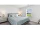 Bright, airy bedroom with large window, carpet, and neutral decor at 598 Strawberry Field Way, Galivants Ferry, SC 29544