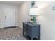 Inviting foyer featuring stylish cabinet, decor, and neutral color palette at 598 Strawberry Field Way, Galivants Ferry, SC 29544