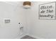 Laundry room with hookups, shelving, and decorative wall art at 598 Strawberry Field Way, Galivants Ferry, SC 29544
