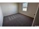 Cozy bedroom featuring neutral carpet and a window for natural light at 623 Castillo Dr., Loris, SC 29569