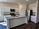 Modern kitchen with stainless steel appliances, granite countertops, and center island at 623 Castillo Dr., Loris, SC 29569